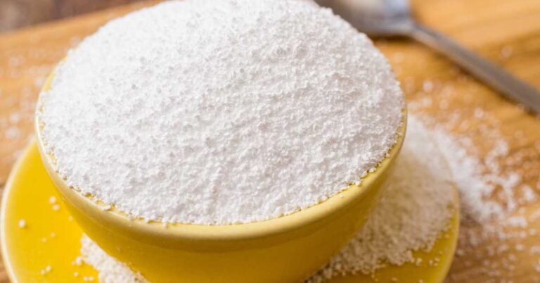 Powdered sorbitol in a yellow bowl, used as a sugar substitute in various dog products.